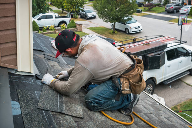 Professional Roofing technician working in Logan, UT